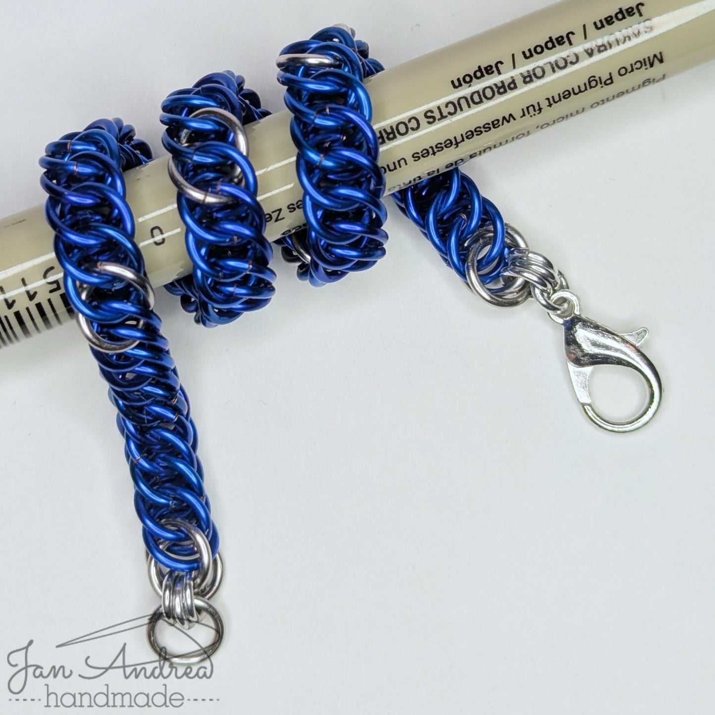 Bracelet wrapped around a Micron pen