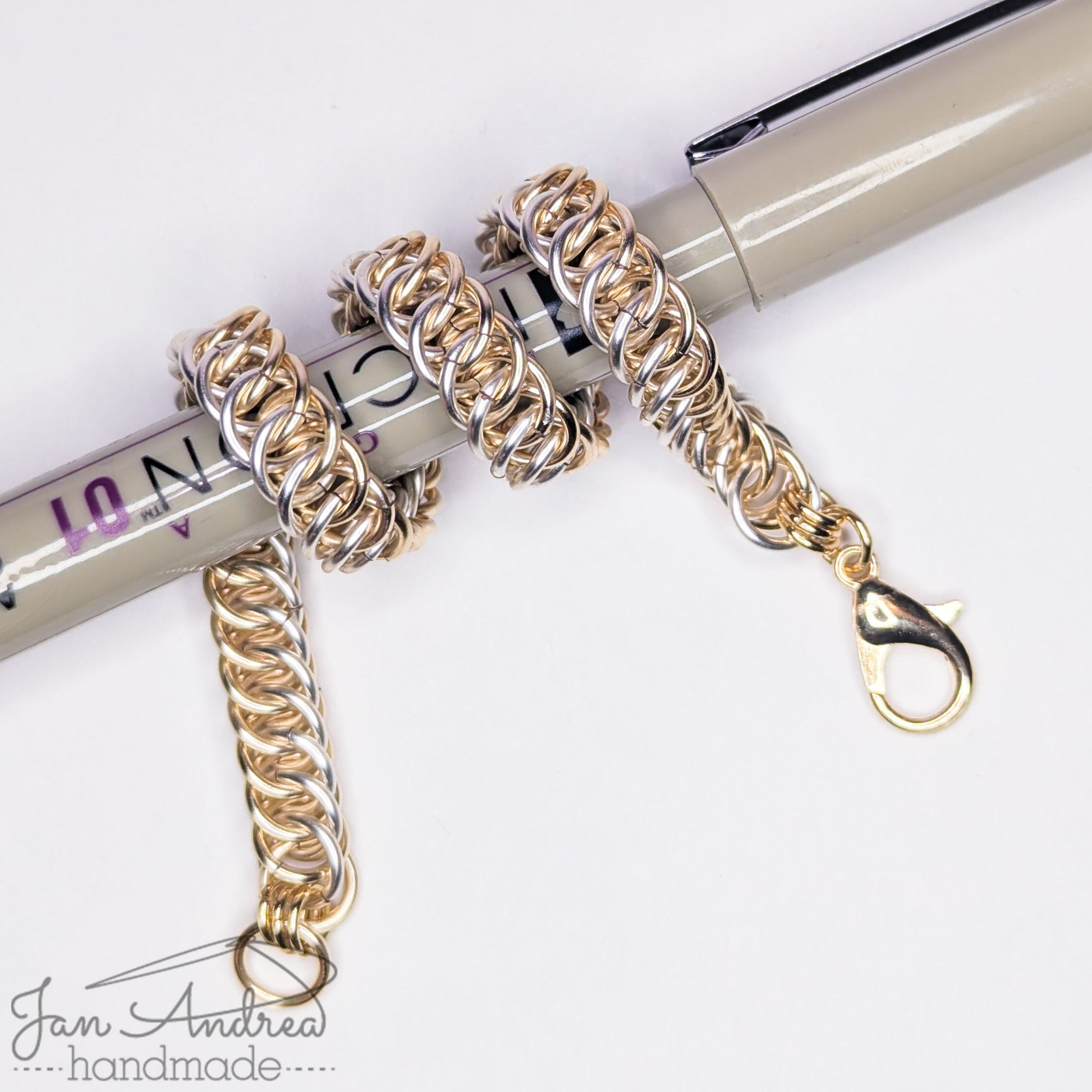 Bracelet wrapped around a Micron pen