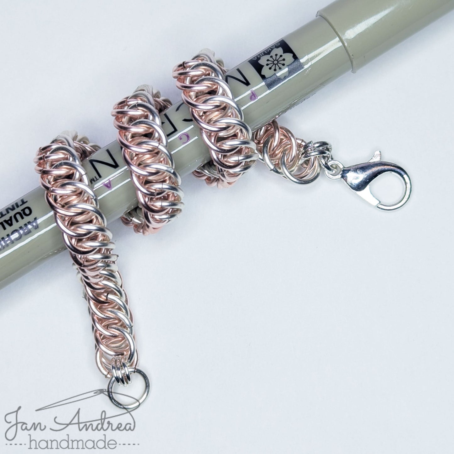 Bracelet wrapped around a Micron pen